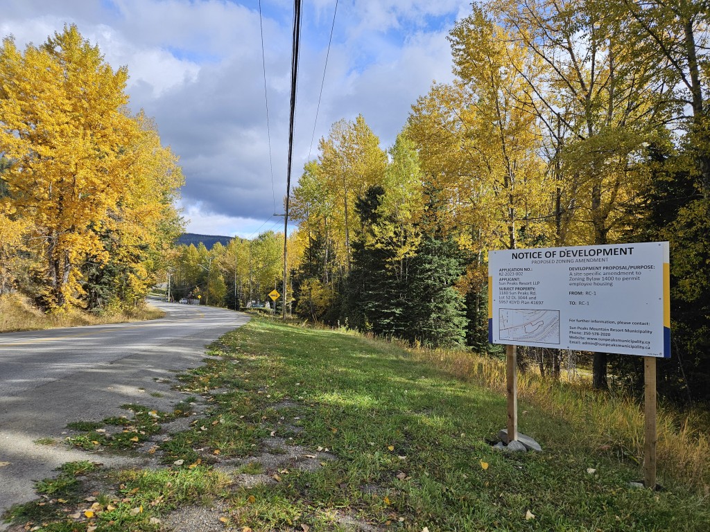 Notice of development sign on the side of the road coming into Sun Peaks.