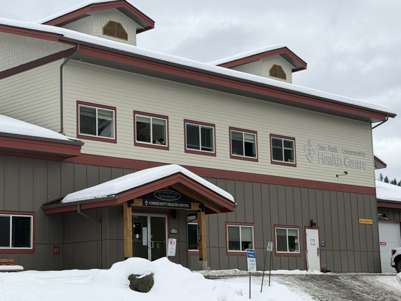Sun Peaks Community Health Centre building with snow on the background